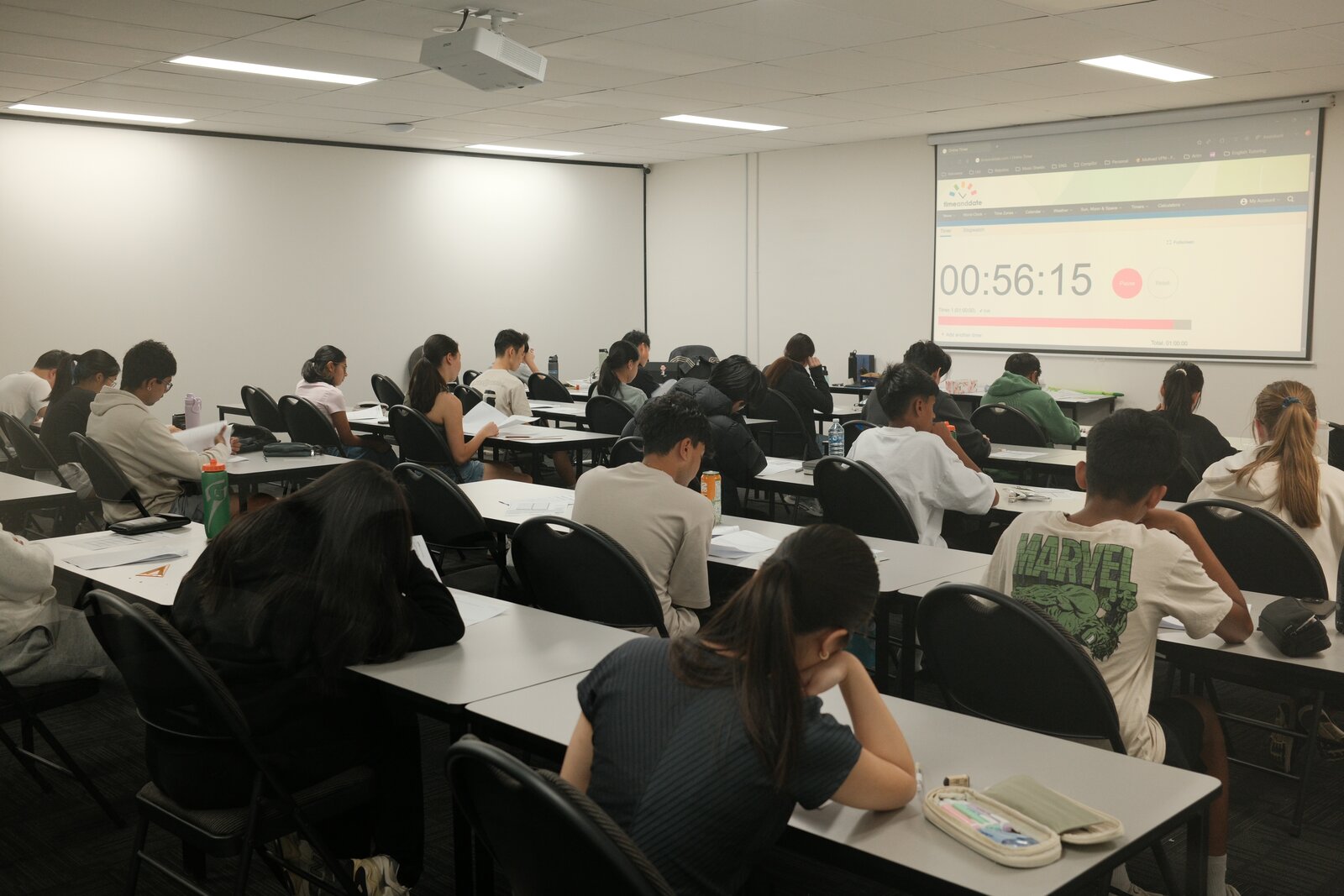 Students sitting a timed test under exam conditions at Artin Education