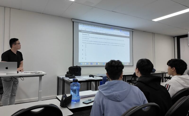 Ming reviewing worked solutions